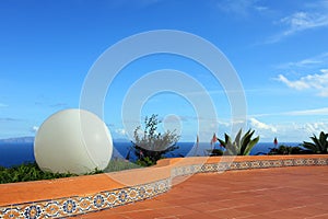 Big white ball, blue sky and sea scenery background