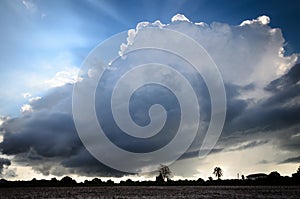 Big White and Black Clouds over Farmland