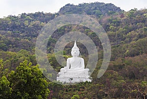 Big white buddha statue sitting on the mountain at Nakhon Ratchasima Thailand