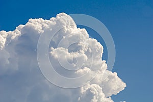 Big white cloud against blue sky