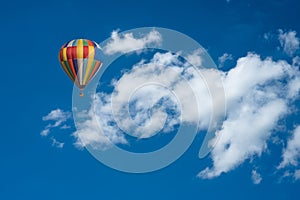 big white clouds on the blue sky, Nimbostratus clouds, an altostratus cloud, hot air balloon in the sky