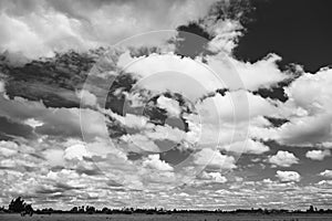 Big white clouds on a dark sky that looks dramatic.