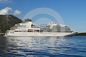 Big white cruise ship in calm blue sea