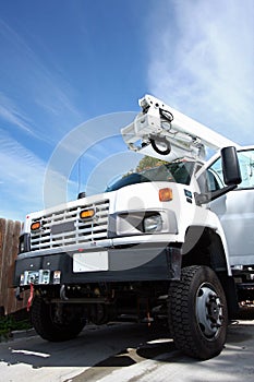 Big white diesel truck with boom