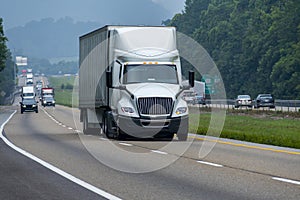 Big White Eighteen-Wheeler Travels Down Tennessee Interstate Highway