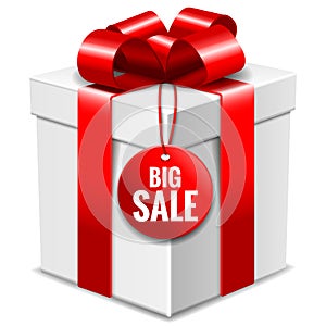 Big white gift box with red bow and big sale tag isolated on white