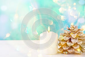 Big White Lit Burning Candle Pine Cone Sparkling Garland Lights Pale Blue Background Christmas New Year Greeting Card