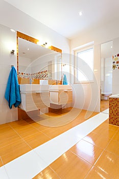 Big white and orange bathroom