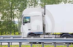 Big white truck goes on highway