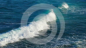 Big white Wave and foam motion on beautiful turquoise Blue Ocean