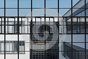 Big window front with partially opened windows of the Bauhaus in Dessau on clear day