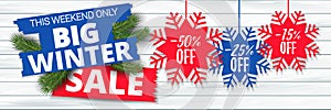 Big winter sale offer, banner template. Colored paper origami snowflake with lettering, isolated on wooden background
