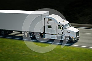 Big withe semi truck on highway