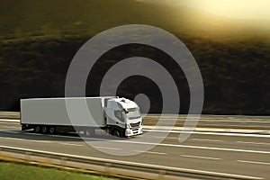 Big withe semi truck on highway with sunlight