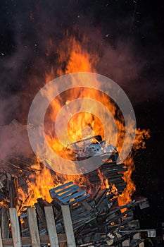 Big Wood Campfire with High Flames at Night