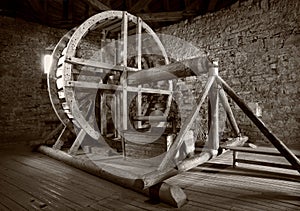 Big wooden millstone wheel in the castle