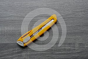 Big yellow blade cutter on table for cutting