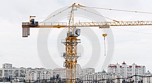 Big yellow construction crane tower