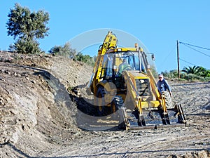 Big Yellow Digger Excavating New Dirt Road