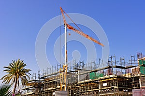 Big yellow hoisting crane photo