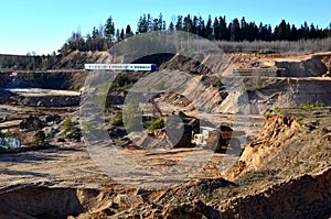 Big yellow mining truck transporting sand