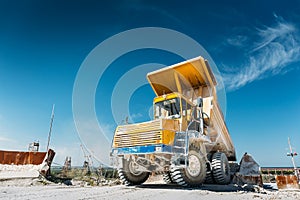 Big yellow mining truck. Work industrial machinery