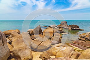 Big yellow rocks in the sea against the blue sky. Thailand. Samui. Gulf of Thailand. Lamai beach