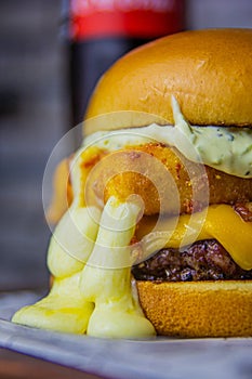 The biggest burger of the town with melted cheese photo