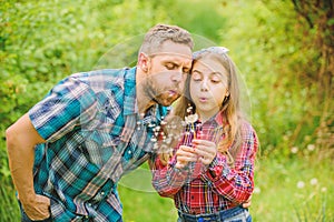 Biggest pollen allergy questions. Father little girl enjoy summertime. Dad and daughter blowing dandelion seeds. Keep