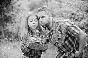 Biggest pollen allergy questions. Father little girl enjoy summertime. Dad and daughter blowing dandelion seeds. Keep