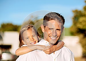 The biggest smile comes when I play with my Dad. a happy family spending time together outdoors.