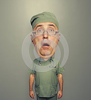 Bighead amazed doctor in glasses and uniform