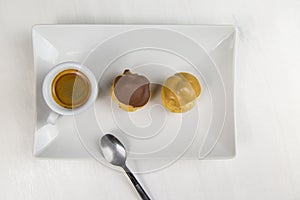 BignÃÂ¨ and coffee on white dish