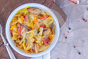 Bigos - stewed cabbage with carrots , smoked sausages and mushrooms, traditional dish of polish cuisine