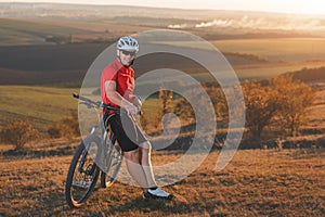 Bike adventure travel photo. Bike tourists ride on the countryside downhill.