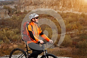 Bike adventure travel photo. Bike tourists ride on the countryside downhill.