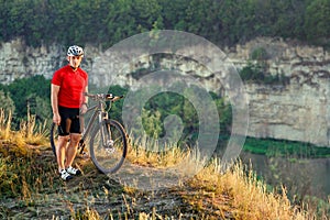 Bike adventure travel photo. Cyclist on the Beautiful Meadow Trail on sunny day.