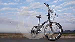 Bike in the beach with cloudy background