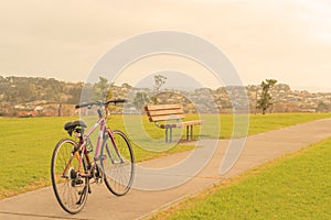 Bike, bench and the view from the hill, Whangaparaoa, around Auckland, New Zealand