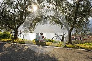 Bike break by sunrise on garda lake (italy)