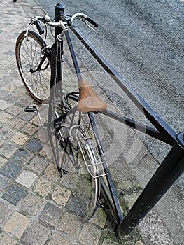 Bike chained with a lock, stolen wheel