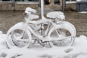 Bike covered with fresh snow