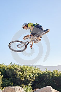 Bike, extreme sport and outdoor fitness, man does dangerous stunt, sports motivation and training in nature. Exercise