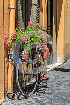 Bike with flowers on the street in Rome