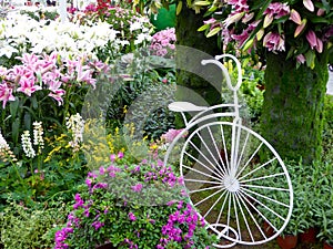 A bike with flowers surrounded