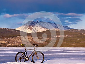 Bike on frozen Lake Laberge, Yukon, Canada