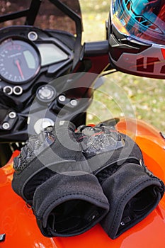 Bike gloves for men on gas tank close up view