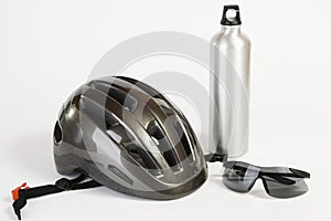 Bike helmet sunglasses and metal water flask