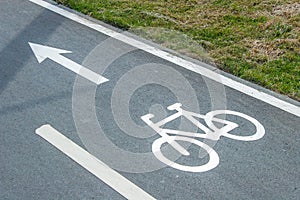 Bike lane sign on asphalt