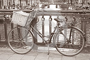 Bike near Canal in Amsterdam, Holand photo